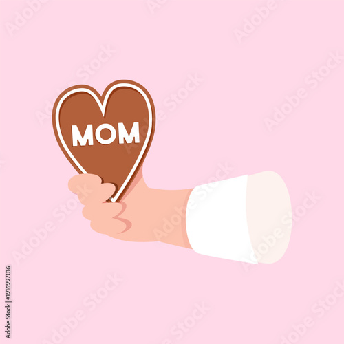 Hand holding mom heart cookie for Mother's Day