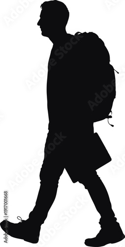 Silhouette of a person with a backpack and laptop walking