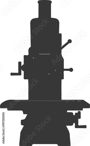 A dark silhouette of a milling machine with various cranks and levers
