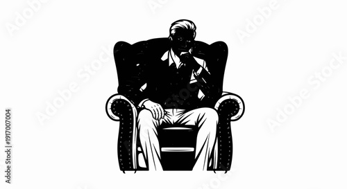 A man in a suit sits thoughtfully in a plush chair