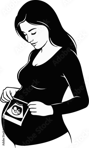 Pregnant woman in black top holds up ultrasound image of baby