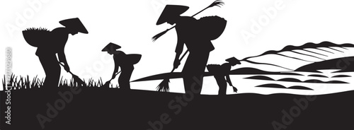 Silhouettes of farmers working in rice fields with conical hats