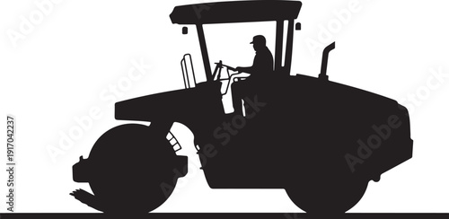 Silhouette of a person operating a tractor with a large front wheel