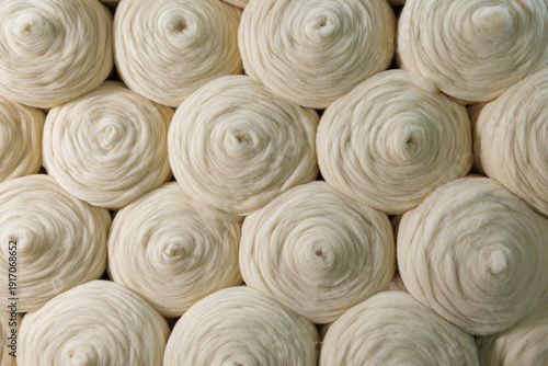Photos Merino wool yarn rolls texture background for textile manufacturing industry