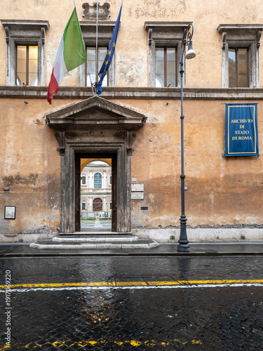 Wallpaper Mural Entrance of the State Archives of Rome with Italian and EU Flags on a Rainy Day in Rome, Italy Torontodigital.ca