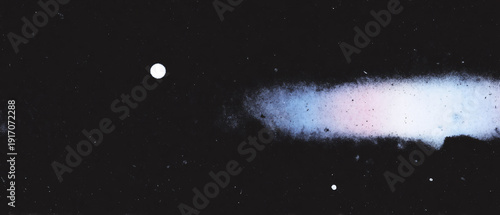 A comet with a bright tail in space against a dark background.