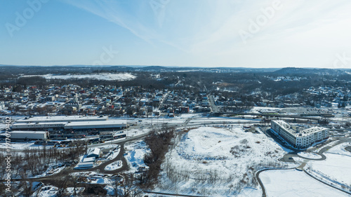 Tableau sur toile Aerial view of Rensselaer near Albany, New York, showing snowy neighborhoods, highways, and industrial buildings in winter