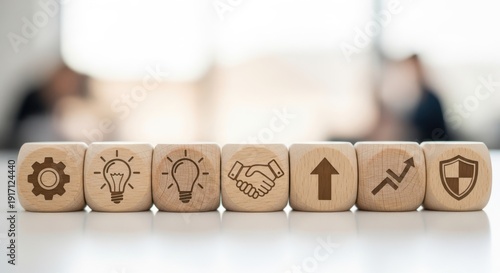Wooden cubes featuring strategic reform icons aligned with shallow focus and bright gently blurred backdrop.