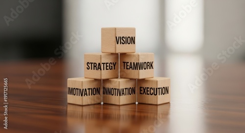 Wooden cubes representing leadership arrangements placed using shallow focus and neutral soft blurred background.