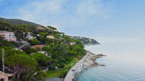 Panoramic aerial view of Varazze, Liguria region, province of Savona, Italy. A beautiful view of the coast surrounded by green hills l Beigua regional natural park, UNESCO geopark. 