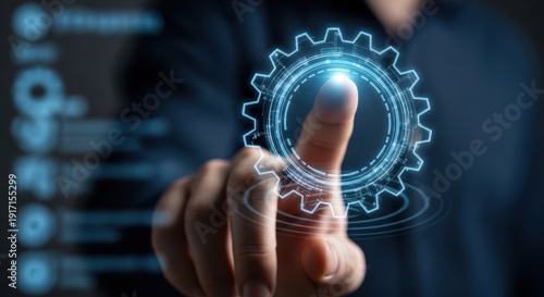 Close up of hand touching a digital settings gear to configure system preferences.