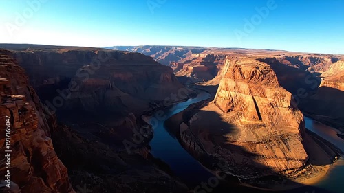 Horseshoe Bend Arizona panoramic aerial showing Colorado River canyon landscape with a clear blue sky