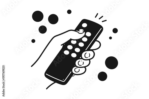 Hand holding remote control with abstract dots