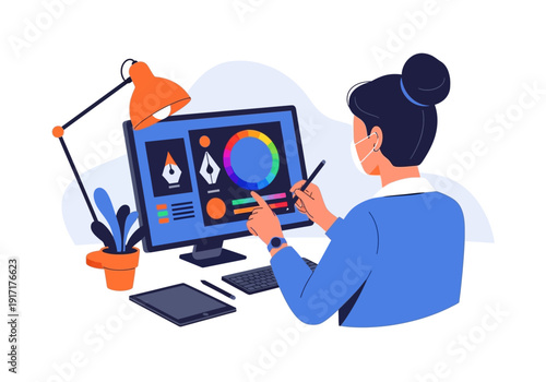 Designer creating graphic illustration on computer with stylus and lamp nearby, focused on digital artwork