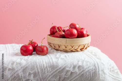 Obraz na plátně Red hawthorn on a white blanket