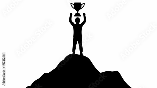 Man standing on mountain summit holding trophy aloft in triumph