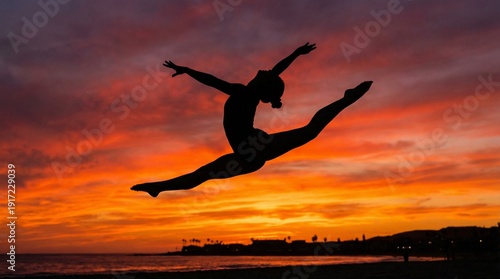 Wallpaper Mural Silhouette of a gymnast performing a split jump against a vibrant sunset sky symbolizing freedom and achievement on a beach Torontodigital.ca