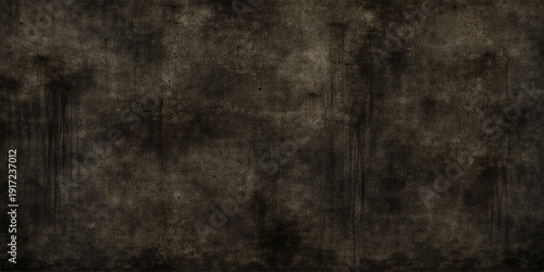 A dark vintage grunge texture featuring an aged, dirty black chalkboard surface with a gray weathered pattern for an antique wall backdrop