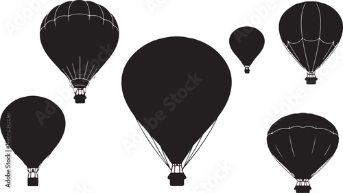 Black hot air balloons floating in the white sky