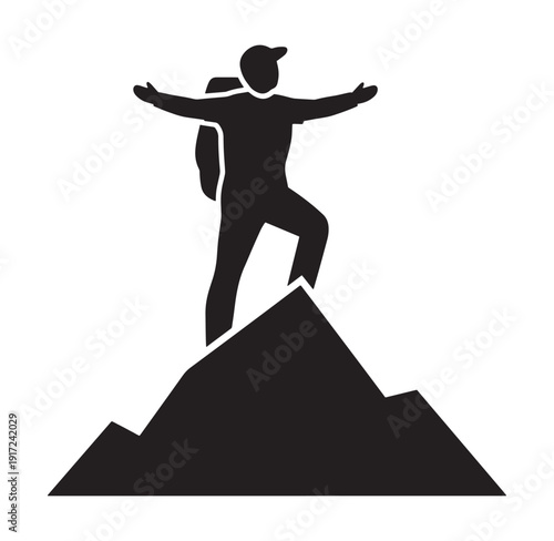 man standing on top of a mountain with arms outstretched in triumph and hiking backpack