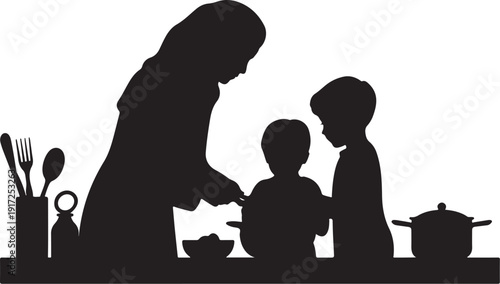 Silhouette of woman and children cooking in kitchen