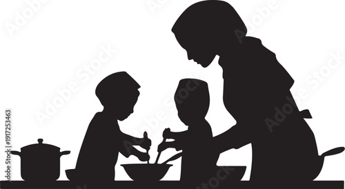 Silhouette of woman and two children cooking together