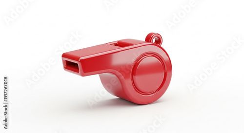 Red plastic sports whistle with finger loop on white background