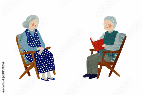 An elderly couple sits facing each other in comfortable chairs