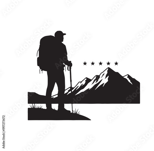 man hiking in the mountains with backpack and trekking poles looking at snow capped peaks