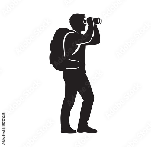 man with backpack looking through binoculars standing alone