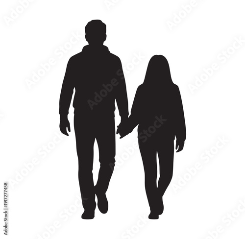 Silhouette of a man and woman walking hand in hand together