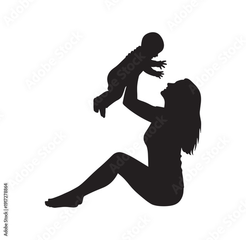 silhouette of woman holding baby in air  happy family moment