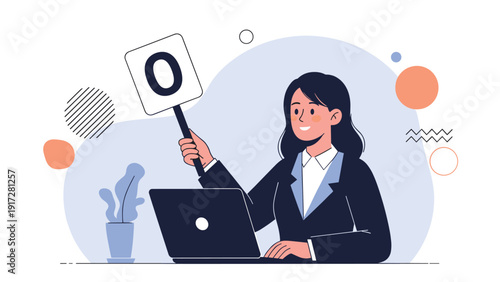 Businesswoman working on her laptop and holding up a square sign with the letter O for okay or correct in an office.