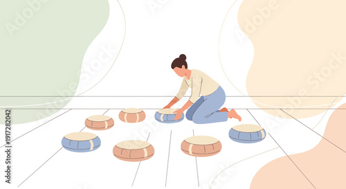 Woman arranging floor cushions for meditation or relaxation