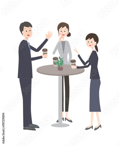 笑いながら会話するスーツ姿の男女