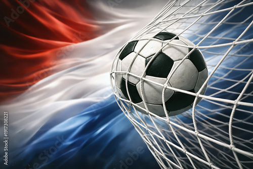 Soccer ball flying towards a goal with a flag in the background