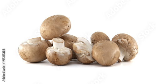Pile of fresh brown cremini mushrooms with white stems on a clean white background