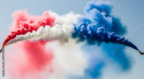 Aerial display of red white and blue smoke trails in the sky