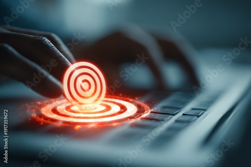 Person interacting with glowing target on laptop keyboard