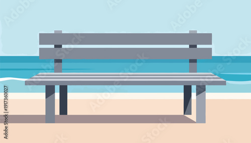 A minimalist grey bench on a sandy beach facing the ocean