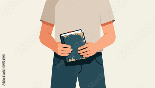 Hands holding a tattered book with a worn cover