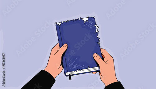 Person's hands holding a tattered blue notebook