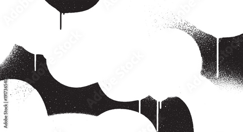 Abstract black and white spray paint drips and splatters on a clean surface.