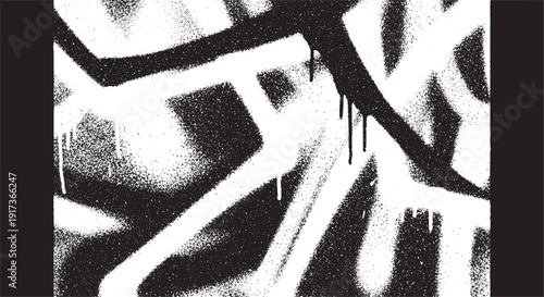 Bold black and white graffiti art on a wall.