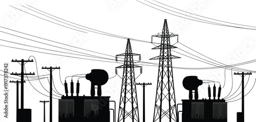 Silhouette of electrical power transmission towers transformers and utility poles electricity substation