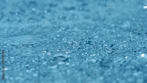 Slow Motion Rain Drops Falling - Water drops on blue background