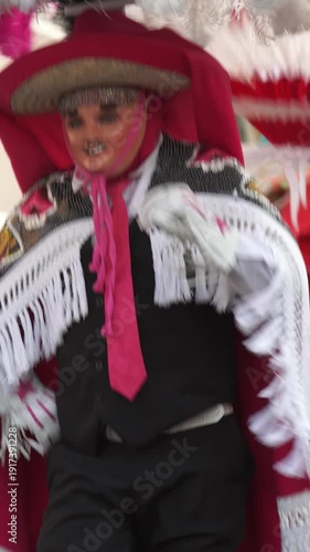 Vertical video of Mexican Huehue Carnival Dancer in Traditional Mask and Colorful Cape