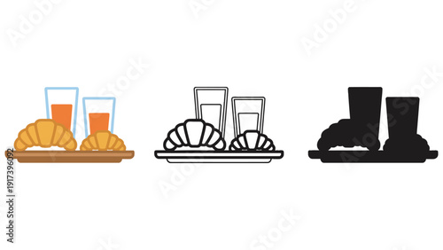 Fresh croissants and orange juice served on a tray for a delightful breakfast.