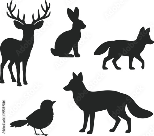Black vector silhouette set of forest animals including a majestic deer stag rabbit hopping fox walking and a bird for wilderness nature wildlife branding