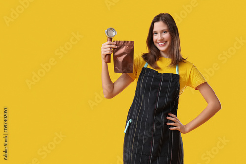 Happy young female barista ...
